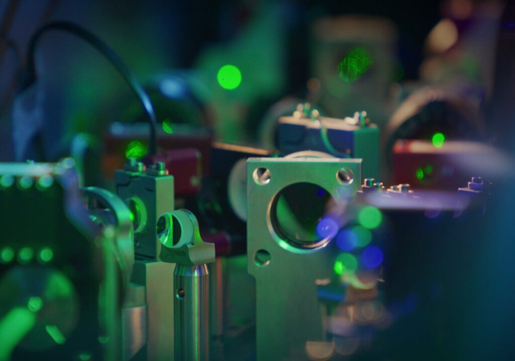 A close-up optics lab photograph from Atom Computing