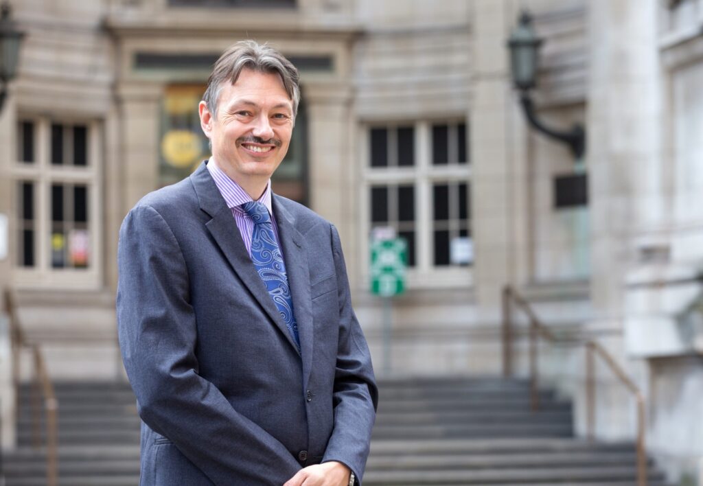 Nigel Brandon, chair of the steering group behind the Royal Society report, standing in front of a building.