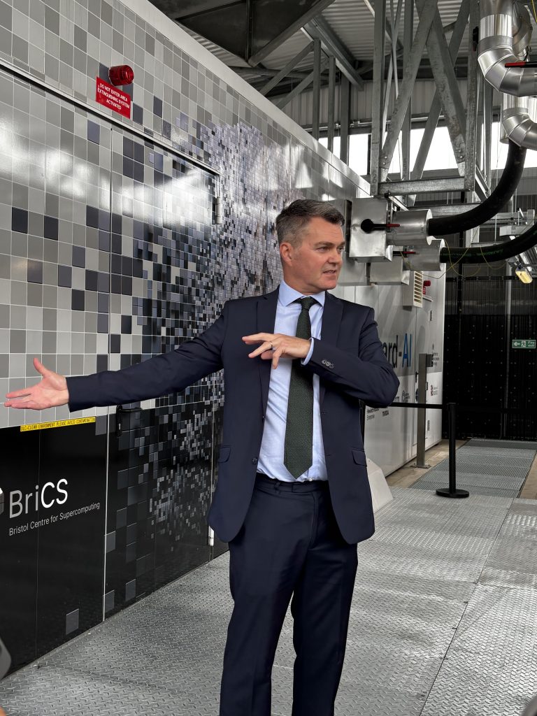 Professor Simon McIntosh-Smith, standing in front of the Isambard-AI data centre.