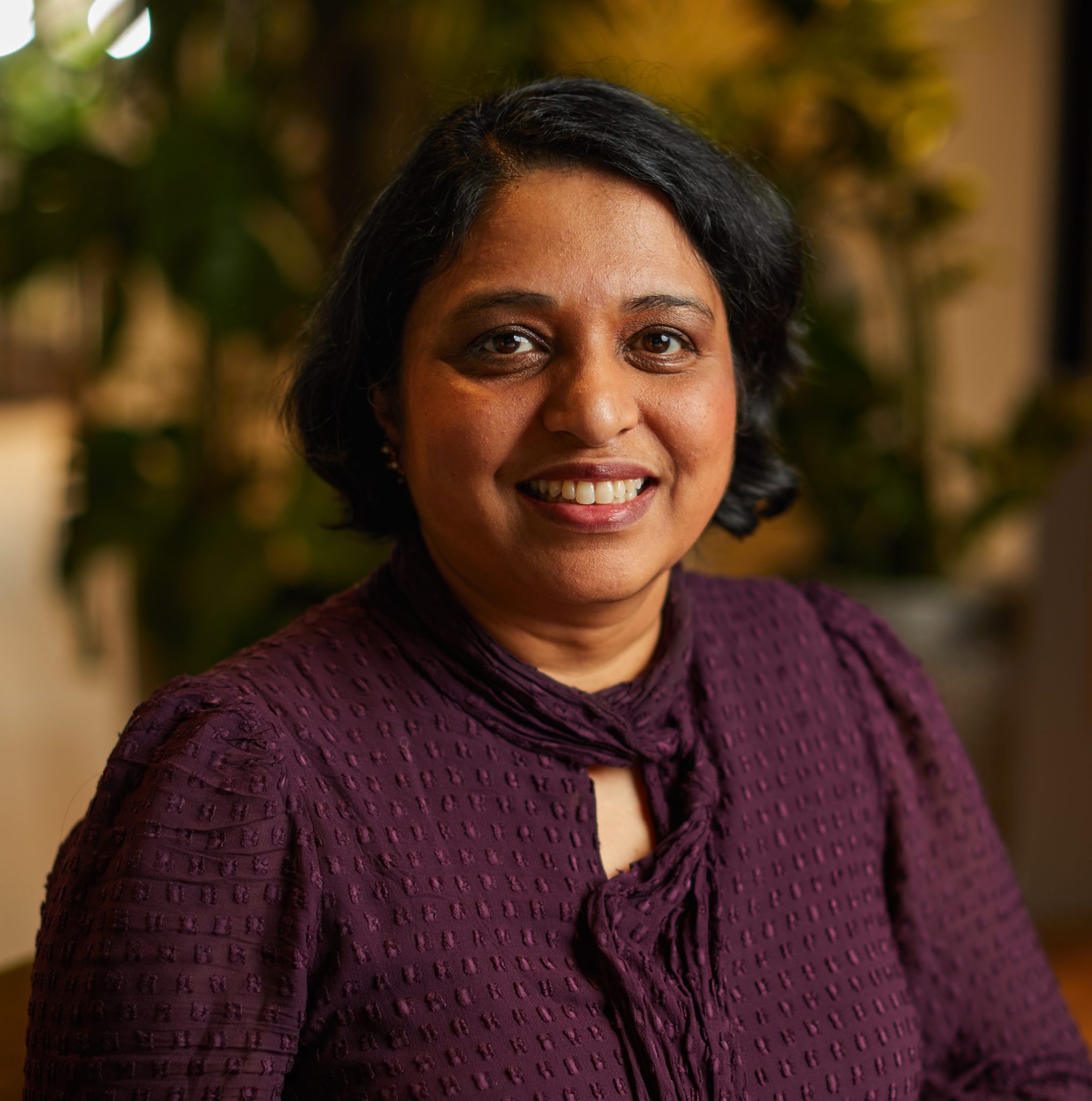 A headshot of Manjari Chandran-Ramesh.