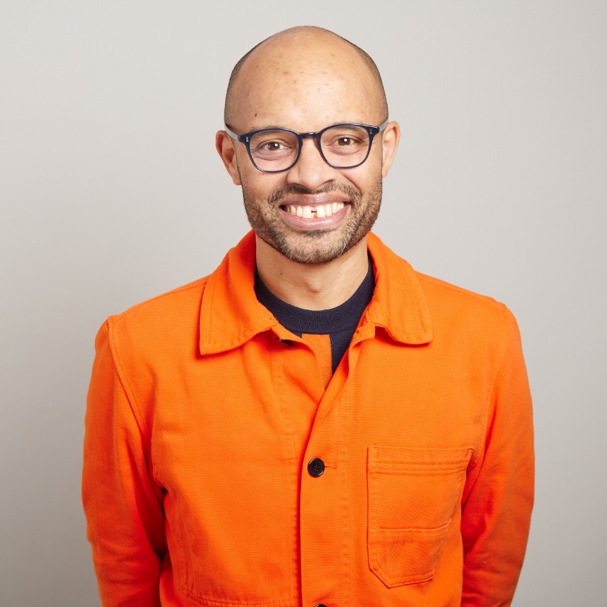 A headshot of Tom Adeyoola.