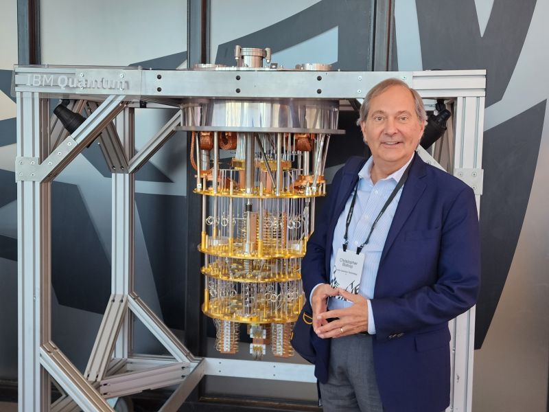 Christopher Bishop, standing in front of quantum computing equipment.