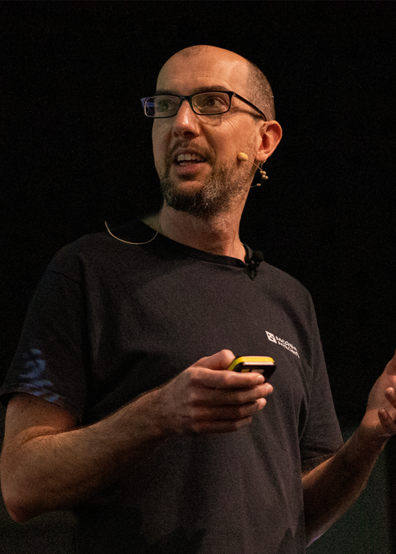 A headshot of Bed Ackland.