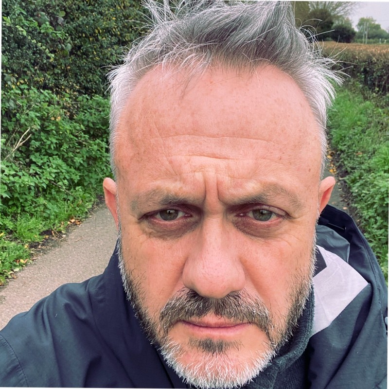 A close-up headshot of Michael Lewis.