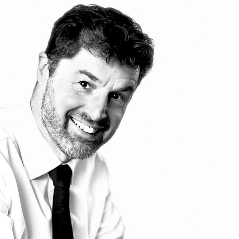 A black and white headshot of Peter Marshall.