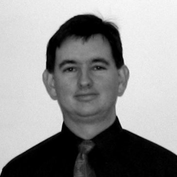 A black and white headshot of Arthur Richards.