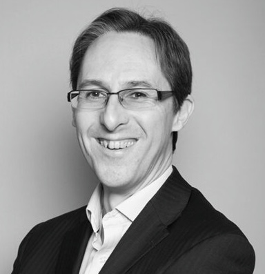 A black and white headshot of Mark West, assistant director of innovation at Roke.