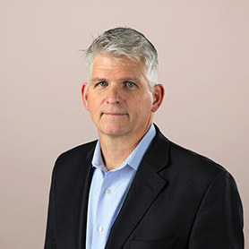 A headshot of Brian Hopkins.